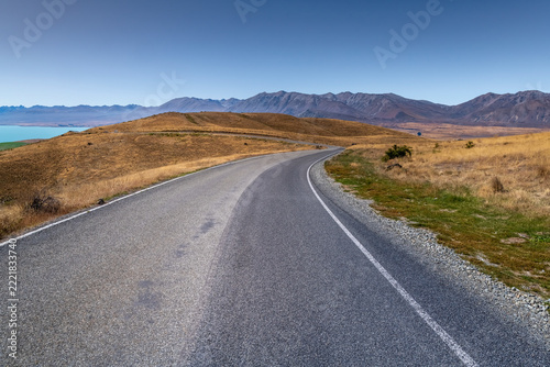 Road background, automotive backplate, curved sealed mountain road in aspirational mountain environment