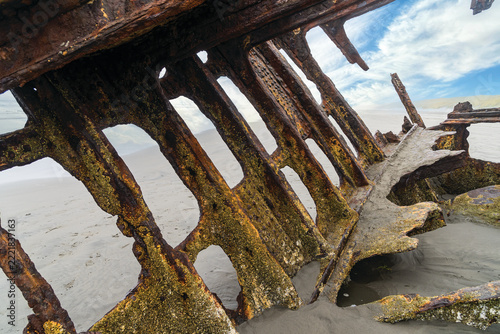 The Peter Iredale, a four masted steel hulled transport ship, built in England, round aground in 1906 and remains on the shore of the Oregon Coast in the Pacific Ocean.
