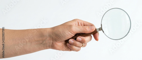 Hand Holding Magnifying Glass Close up Search and Discovery Concept