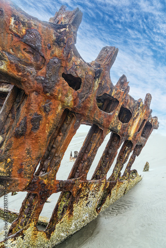 The Peter Iredale, a four masted steel hulled transport ship, built in England, round aground in 1906 and remains on the shore of the Oregon Coast in the Pacific Ocean.