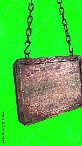 Wooden rustic hanging sign board swaying gently on metal chains against a professional chroma key green screen background for easy compositing