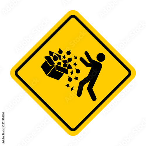 Warning sign depicting falling objects with a person in danger  