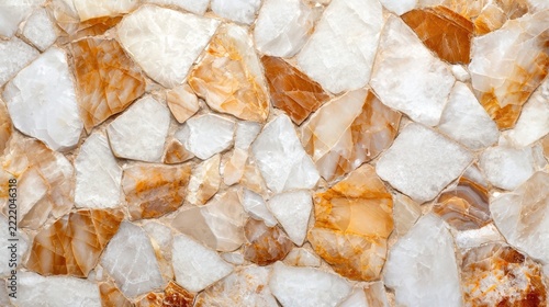 Close-up of a textured surface made from irregularly shaped brown, white, and beige marble stones.
