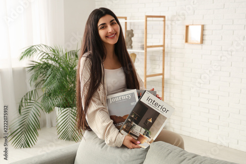 Interior design inspiration and travel planning, young woman reading lifestyl...