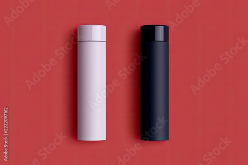 Two cylindrical containers, one light pink, one dark, on red