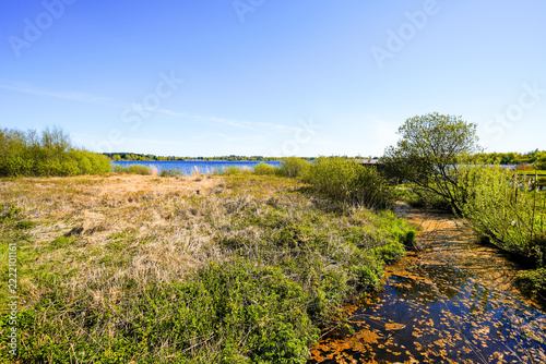 View of Lake Flögeln and the surrounding landscape. Nature at the moorland lake near Bad Bederkesa.
