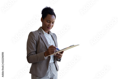 Businesswoman reviewing documents and writing on clipboard
