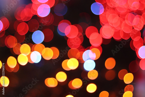 Colorful red and gold bokeh lights background for Christmas and New Year festival event