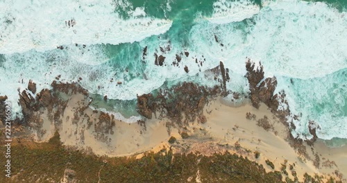 Drone flight over rocky coastline and crashing waves, South West Western Australia