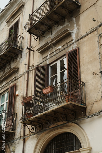 Old Building Facade with Wrought Iron Balconies