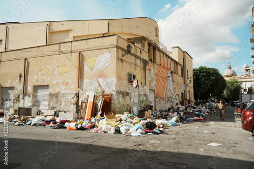 Trash Pile Against Building Wall