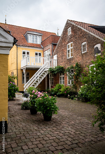 View into the backyard of a Danish brick house