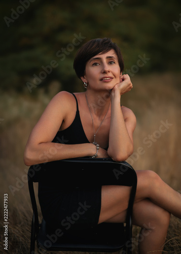 Beautiful Woman in a Rural Autumn Landscape at Sunset, Golden Hour Portrait and Countryside Lifestyle