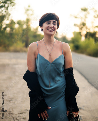 Happy Middle-Aged Woman Laughing Outdoors, Authentic Joy, Positive Lifestyle and Natural Beauty Portrait