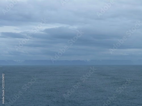 Approaching Iceland Coast Across Open Ocean Under Gray Sky