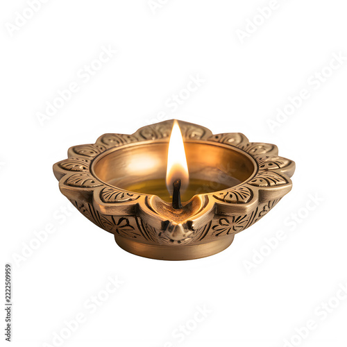 Lit metallic oil lamp with ornate floral engravings