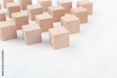 Several natural wood blocks neatly spaced on a white table
