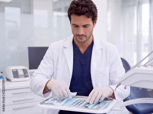 Dentist prepare dental instrument for patient treatment