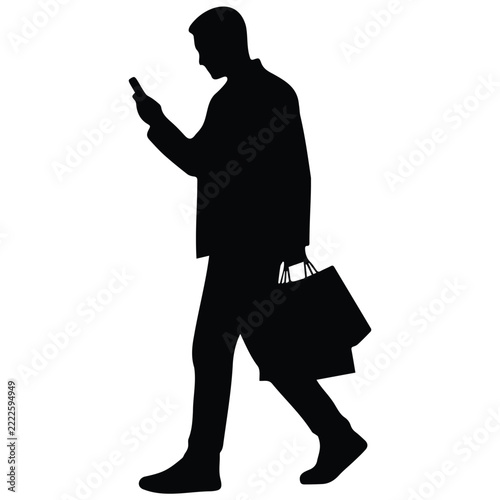 Black silhouette of man walking and checking mobile phone while carrying many shopping bags.