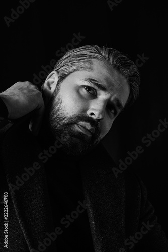 Elegant man showcasing stylish attire in a captivating pose