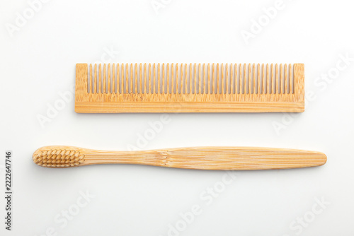 Comb and Wooden Toothbrush on White Background, Eco Friendly Zero Waste Personal Care Set, Flat Lay Top View