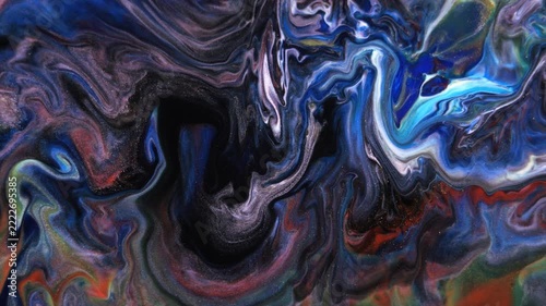 Abstract art, colorful marble background. The moving texture of ink rivers. A combination of pastel blues, browns, whites, reds, and yellows.