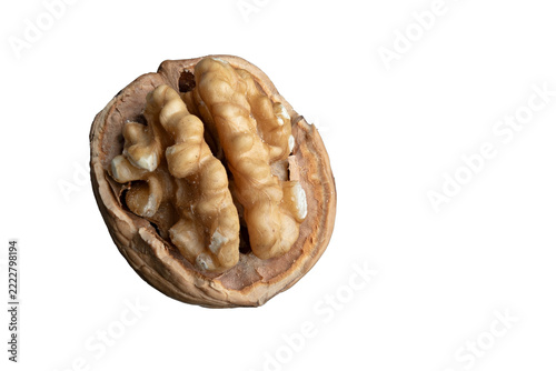 Close-up of a cracked walnut with golden kernel isolated against a transparent background
