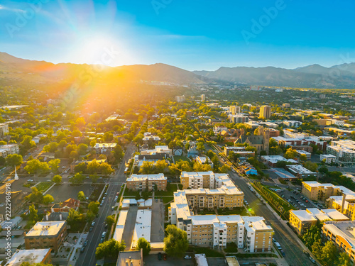 Golden sunrise illuminates modern downtown Salt Lake City buildings