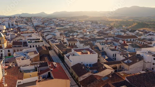 Aerial view of the packed rooftops and narrow streets of Ronda below the sierra, Spain.