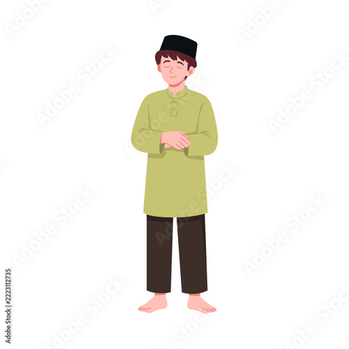Muslim Boy Praying in Green Traditional Clothing for Ramadhan