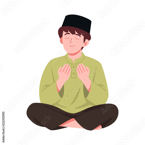 Muslim Boy in Peci Praying Sincerely During Ramadan Celebration