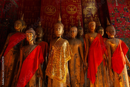 Ancient wooden Buddha images in the temple of Wat Visounnarath.