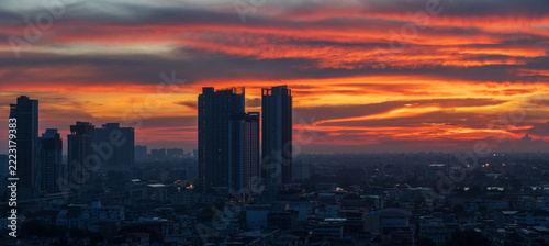 High-angle view of the Bangkok skyline at sunset.