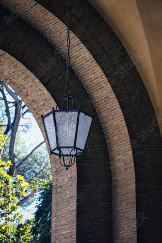 View Of Classic Black Hexagonal Hanging Lantern On Building Facade