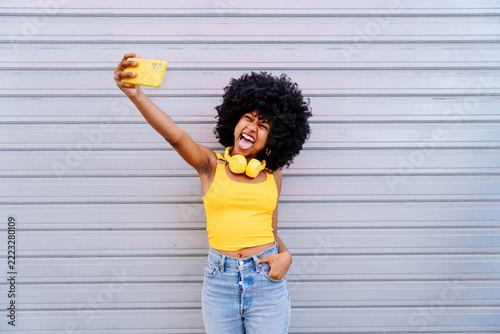 Beautiful young black woman outdoors in the city