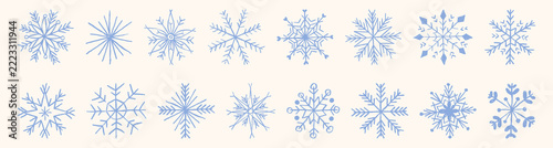 Hand-drawn snowflake collection with crayon chalk texture. Winter snow icons in sketch style for Christmas designs and festive patterns. Vector isolated holiday illustrations. Blue pastel snowflakes.