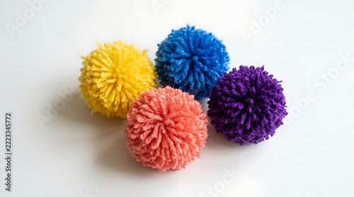 Colorful Yarn Pom Poms in Yellow Blue Coral and Purple