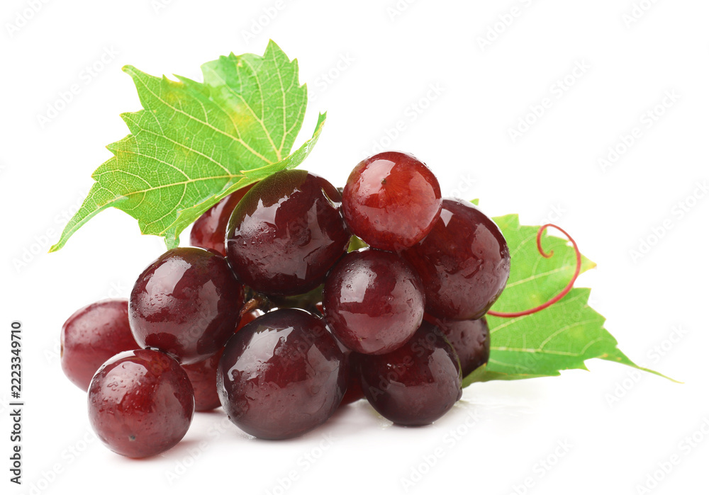 Fototapeta premium Fresh ripe grapes and green leaves isolated on white