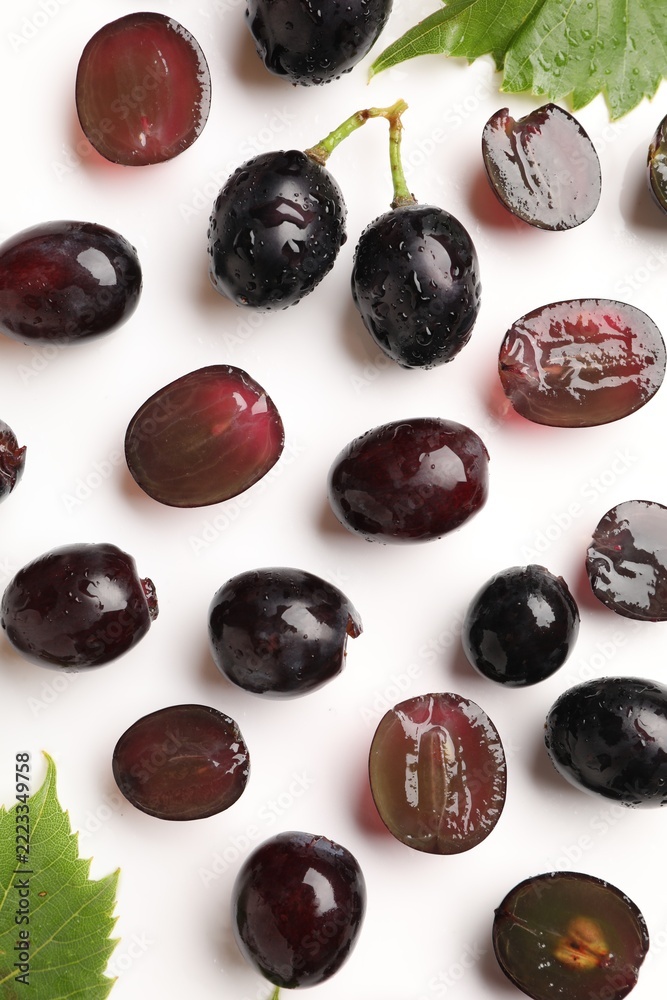 Fototapeta premium Fresh ripe grapes on white background, flat lay