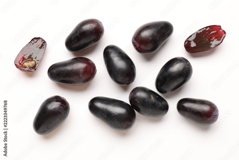 Fototapeta premium Fresh ripe grapes on white background, flat lay