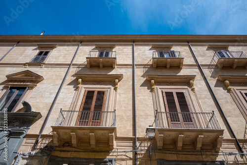 Facade of a building seen from the street in Palermo, Sicily, Italy