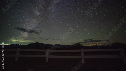 Time lapse of Milky Way stars and thin clouds over a ranch in the southwest