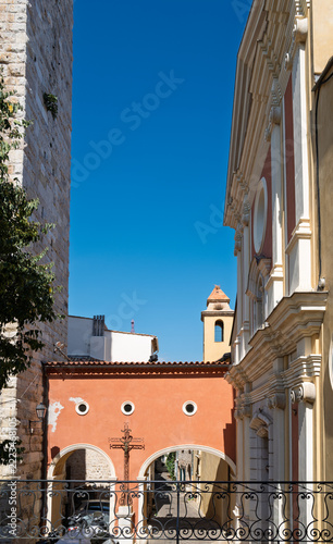 Historic church facade and arched passage in the old town of Antibes