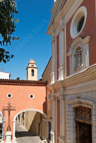 Ornate historic church facade and archway in Antibes, French Riviera
