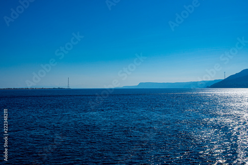 A photo of the view of the two banks of the Strait of Messina (Italy)