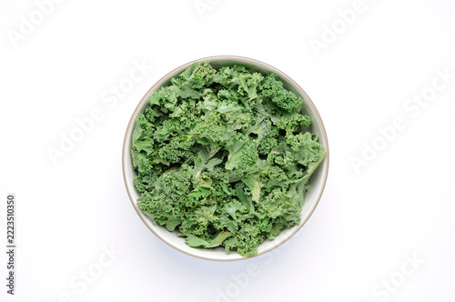 Bowl of kale on white top view