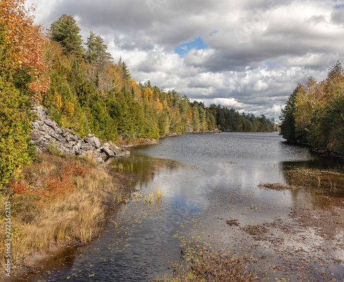Magnetewan River in northern Ontario in with mixed boreal forest in fall colors in October