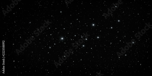 A vast expanse of the night sky, sprinkled with countless twinkling stars, reveals the breathtaking beauty of the cosmos.