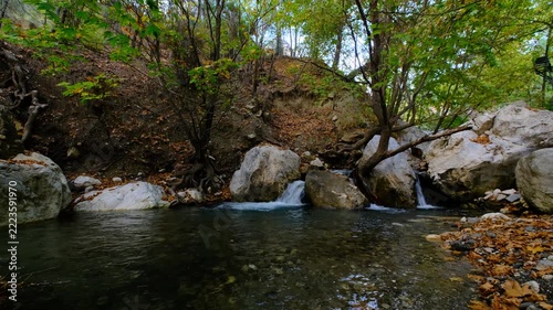 Scenic Woodland Creek with Multiple Cascades in Autumn. Tiered Waterfalls Flowing Through an Autumn Forest Stream. Small Cascading Waterfalls in a Colorful Fall Woodland.