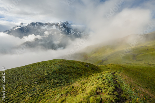 Snowy Annapurna peaks in clouds above Kori ridge, Nepal